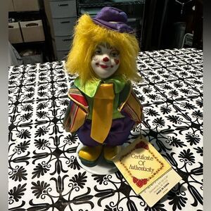 Collectors Choice - Bisque Porcelain clown on stand